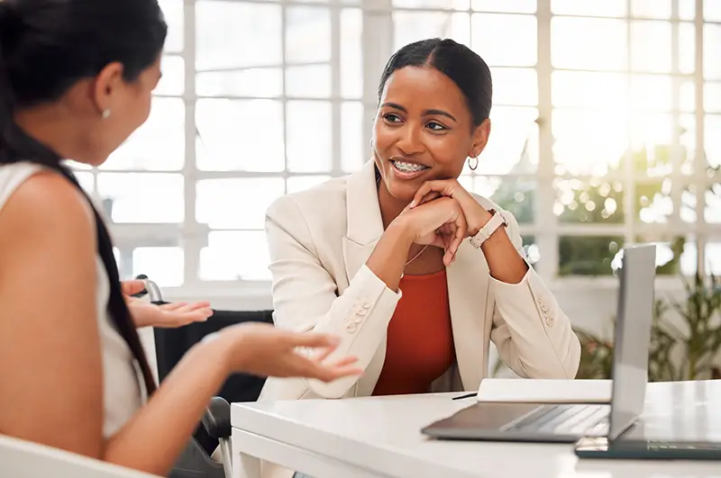 Business women striking a deal over lunch