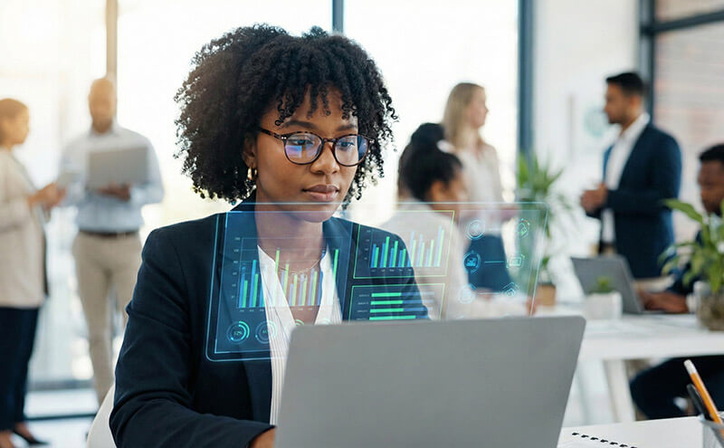 small-business-ai-processes woman on laptop using AI tools